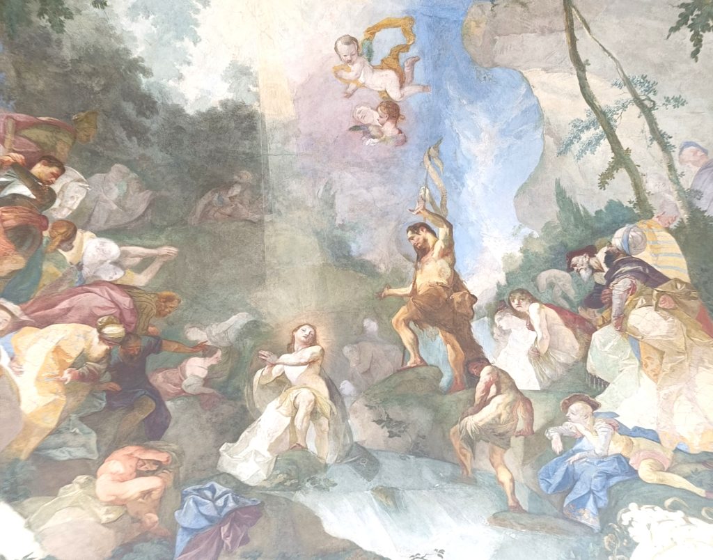 Baroque-style ceiling fresco depicting mythological and allegorical figures around a central figure holding a staff above a waterfall